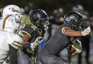 Imani Christian Academy’s Gabriel Jenkins (1) searches for room to run against Highlands last season.