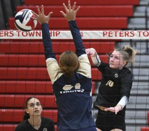 Quaker Valley’s Mia Gartley hits against Hopewell’s Alyssa Spang during the WPIAL Class 2A girls volleyball championship Nov. 2, 2024 at Peters Township High School.