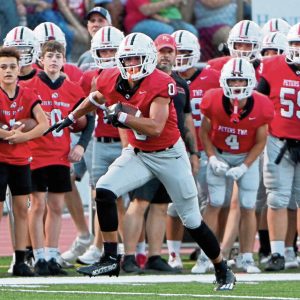 Peters Township’s Lucas Shanafelt picks up yardage against McKeesport on Aug. 30, 2024, at Peters.