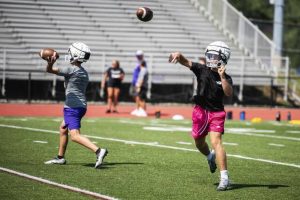 Plum’s Antonio Hanzlik, right, and John Nonnenberg, conduct passing drills during team practice on Monday, Aug. 4, 2025 at Plum High School.