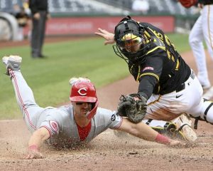 Pirates catcher Henry Davis tags out the Reds‘ Spencer Steer at home plate on Wednesday, May 21, 2025, at PNC Park.
