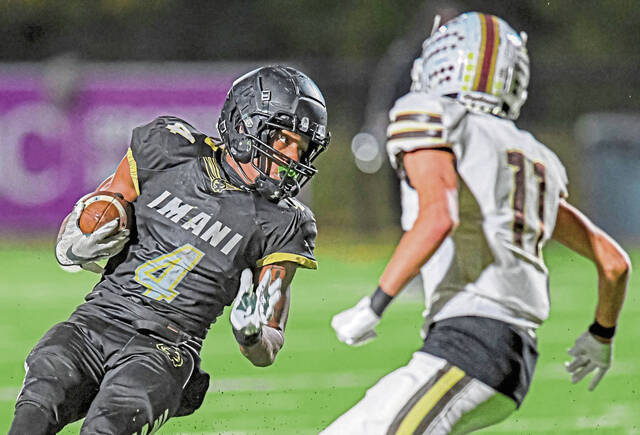 Imani Christian Academy’s David Davis (4) cuts back against Highlands’ Aiden Burford on Friday, Nov. 8, 2024, at UPMC Graham Field.
