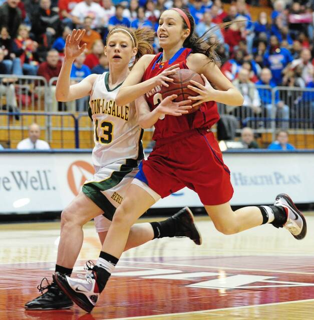 Seton LaSalle’s Molly Tuite fouls Jeanette’s Ciara Gregory in the first half at AJ Palumbo Center during the girls WPIAL Class AA championship game March 6, 2010.