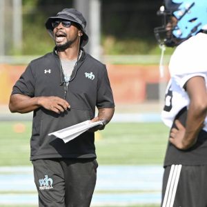 Woodland Hills head coach Brian Tarrent works with his team during practice on Tuesday, Aug. 5, 2025, at the Wolvarena.