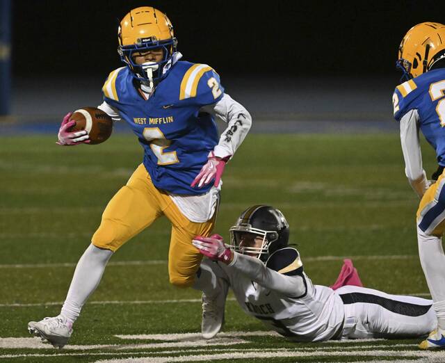 West Mifflin’s Armand Hill avoids Knoch’s Wyatt Fraser during a game last October. Hill rushed for more than 1,600 yards last season and scored 23 touchdowns.