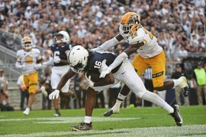 Penn State tight end Khalil Dinkins catches a touchdown pass in front of Kent State safety Josh Baka (20) during a game last season.