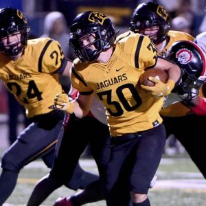 Thomas Jefferson’s Tyler Eber scores through the Aliquippa defense during their WPIAL Class 4A semifinal last season.