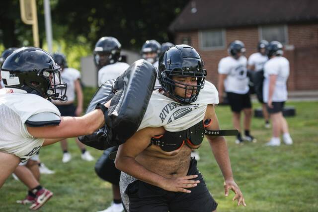 Riverview defensive end Jack Reynolds runs reps with teammates Monday, Aug. 4, 2025 at Riverview High School in Oakmont.