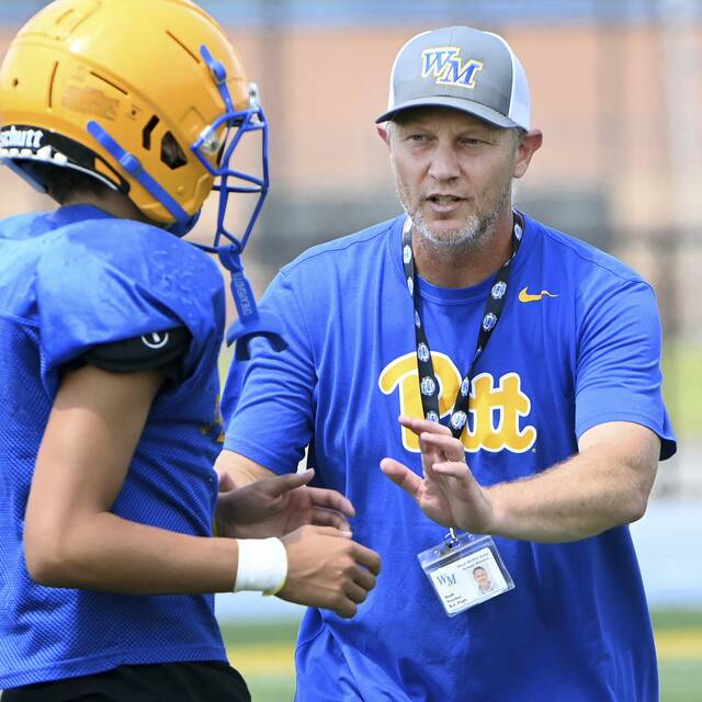 West Mifflin head coach BJ Pugh works with his team during practice on Thursday, Aug. 7, 2025, at Titan Stadium in West Mifflin.