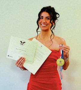 Quaker Valley graduate Molly MacDonald displays her President’s Volunteer Service Award.