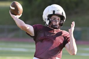 Chartiers-Houston quarterback Aaron Walsh throws during practice Tuesday.