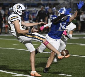 Hempfield’s Aidan Allison goes for the block as Norwin’s Evan Pfeifer punts Oct. 4, 2024 at Riverside Park.
