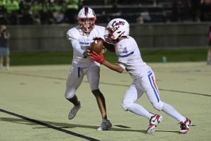 Chartiers Valley’s Tayshaun Lewis takes a handoff from Luke Miranda during a game against Belle Vernon last season.