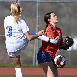Mt. Pleasant goalkeeper Laurel Rummel fends off Burrells McKenna Miller during their WPIAL Class 2A quarterfinal Oct. 26, 2024.
