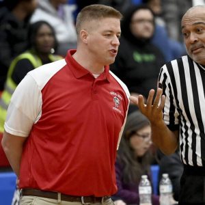 Rob Niederberger talks with an official during Shaler’s game against Woodland Hills on Jan. 30, 2024, at Shaler.