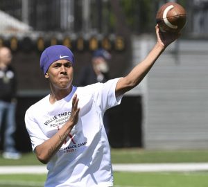 East Allegheny quarterback Cedric Mack throws during the Willie Thrower quarterbacks camp in June at Valley High School.