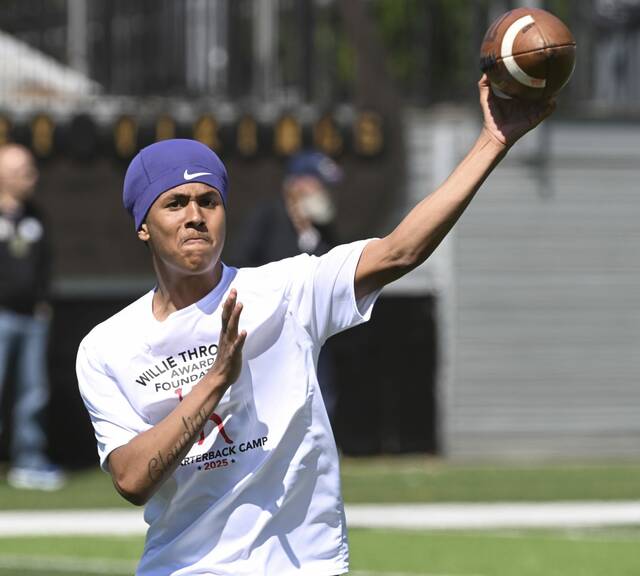 East Allegheny quarterback Cedric Mack throws during the Willie Thrower quarterbacks camp in June at Valley High School.