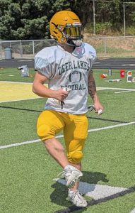 Deer Lakes’ Ryan Love warms up before practice on the first official day of high school football camp Monday, Aug. 11, 2025.