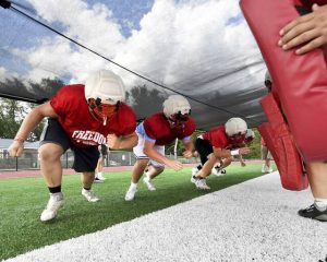 Freedom’s Eli Cottrill works out with his linemates at practice on Wednesday, Aug. 13, 2025, in Freedom.