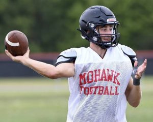 Mohawk quarterback Bobby Fadden throws a pass during practice on Wednesday, Aug. 13, 2025, at Mohawk.