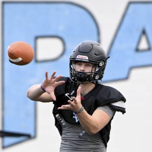 Seneca Valley’s Adam Gehm catches a pass during preseason practice last year.