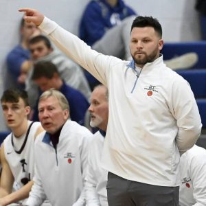 Greensburg Central head coach Christian Hyland watches from the bench during the Centurions’ game against Kiski Area on Dec. 21, 2024, at Hempfield.