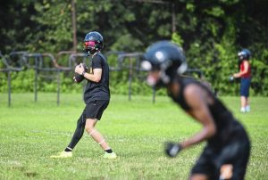 Springdale’s Jackson Williams takes part in a 7-on-7 scrimmage against Summit Academy on July 25 at Springdale.