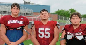 Mt. Pleasant linemen (from left) Carter Strayer, Payton Schaum and Caleb Pease will anchor a physical offensive line during the 2025 season.