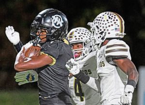 Imani Christian Academy’s Gabriel Jenkins (left) is chased down by Highlands’ Darius Cherry (center) and Jahmar Wright (right) after a long run on Friday, Nov. 8, 2024, at UPMC Graham Field.
