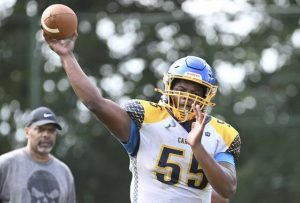 Carrick’s Treshawn Beasley throws during practice Wednesday at Phillips Park Field.