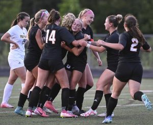 Latrobe celebrates with Annalyse Bauer after scoring a first-half goal against Penn-Trafford last season.