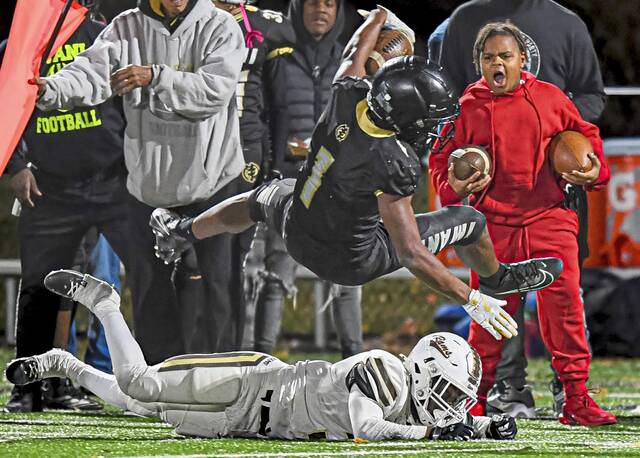 Imani Christian Academy’s Gabriel Jenkins (1) soars out of bounds after a big gain on Friday, Nov. 8, 2024, at UPMC Graham Field.
