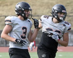 Bethel Park’s Charlie Simmons (left) works out with Jovian Smith during practice Aug. 6.