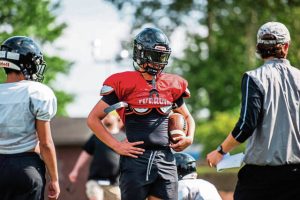 Riverview quarterback Connor Kmetz listens to coaches during practice Monday, Aug. 4, 2025 at Riverview High School in Oakmont.
