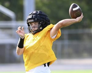Quaker Valley quarterback Atticus Barr throws a pass during practice Aug. 11 at Chuck Knox Stadium in Leetsdale.