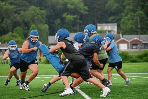 Leechburg lineman Jayden Rosenberger pulls to the outside line during drills.