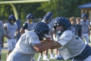 Kiski Area lineman Wilson Spencer (right) works out during the first day of practice Aug. 11 at Kiski Area.