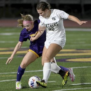 Plum’s Gianna Revetta battles Franklin Regional’s Halle Beatty for possession last season.
