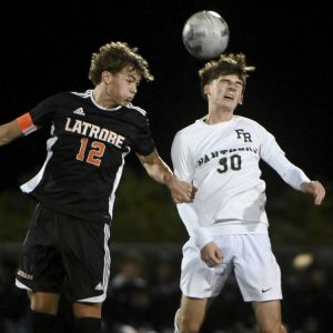 Latrobe’s Roman Agostoni battles Franklin Regional’s Keaton Sheetz for a header last season.