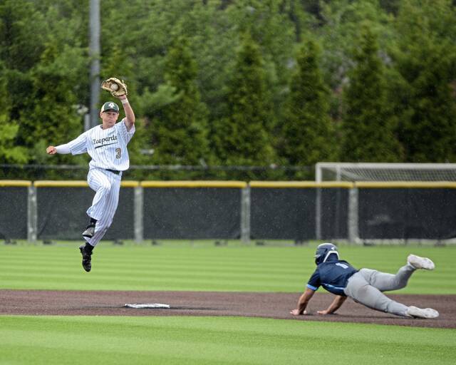 Belle Vernon’s Zach Plymire takes throw as Central Valley’s Blake Heater slides into second base during the WPIAL Class 4A third-place game in May.
