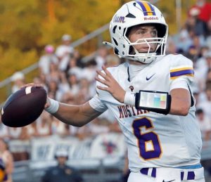 Plum quarterback John Nonnenberg looks downfield against Franklin Regional on Friday.