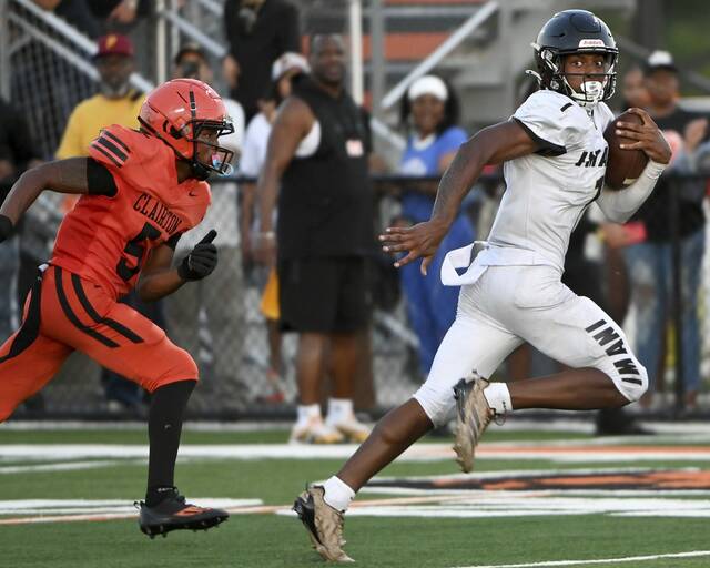 Imani Christian’s Gabe Jenkins scores past Clairton’s Taris Wooding during the second quarter Friday.