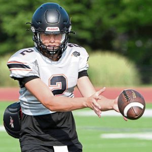 Bethel Park quarterback Evan Devine takes a snap during practice earlier this month.