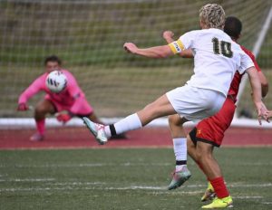 Deer Lakes’ Peyton Kushon’s shot beats North Catholic keeper Dylan Shantz on Tuesday at J.C. Stone Field.