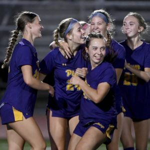 Plum’s Brenna McLaughlin (24) celebrates with teammates after scoring during the first half against Franklin Regional on Monday.