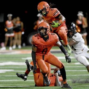Clairton’s Donte Wright leaps past Imani Christian’s Dajuam Craighead during their game on Friday, Aug. 22, 2025, at Tyler Boyd Stadium.