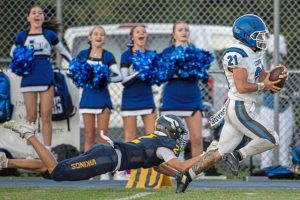 Leechburg’s Timmy Andrasy (21) is tripped up by Apollo-Ridge’s Gage Wingard (2) last Friday at Apollo-Ridge.