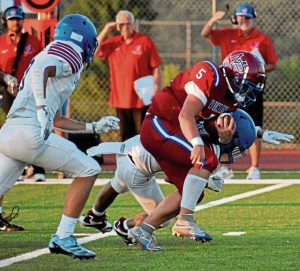 Mt. Pleasant's Dane Firmstone breaks several tackles for a long run Aug. 22, 2025, against Jeannette at Mt. Pleasant High School.
