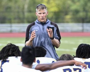 Shady Side Academy coach Andrew Geisler talks with his team after a preseason practice.