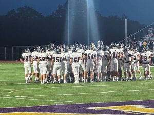 Latrobe players gather on the field before their game against Plum on Friday, Aug. 29, 2025.